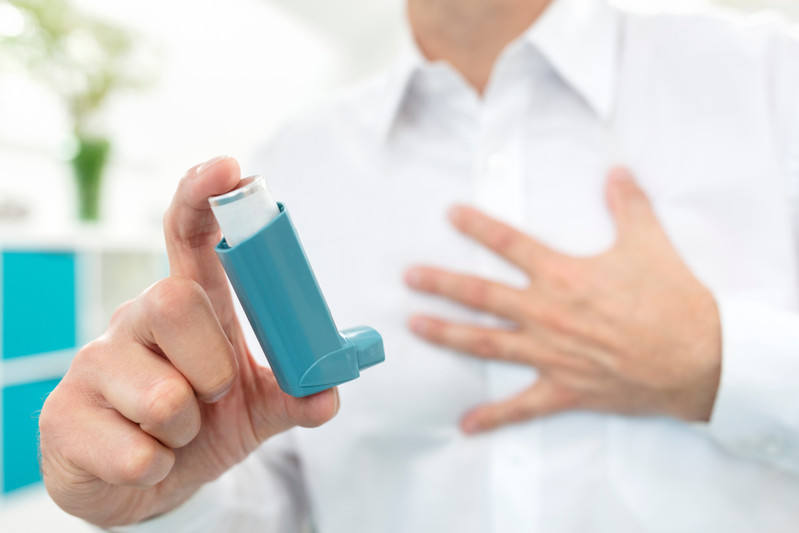 Man,Using,Blue,Asthma,Inhaler,Medication,With,Breathing,Difficulties